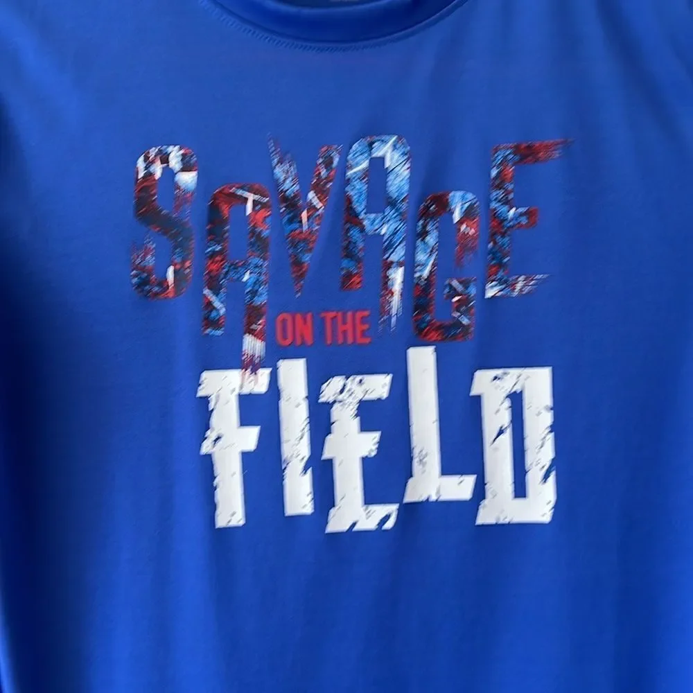 Reebok youth boys size 14-16 blue Savage on the Field shirt.